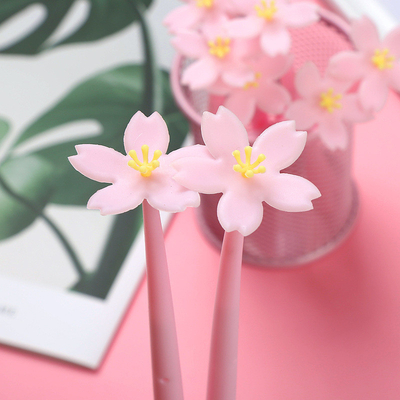 গুণ 12pcs Cute Pink Flower Gel Ink Pen Writing Pen 0.5mm Black Ink Fun Kawaii Pen বাল্ক ফর কিডস অফিস স্কুল সরবরাহ কারখানা